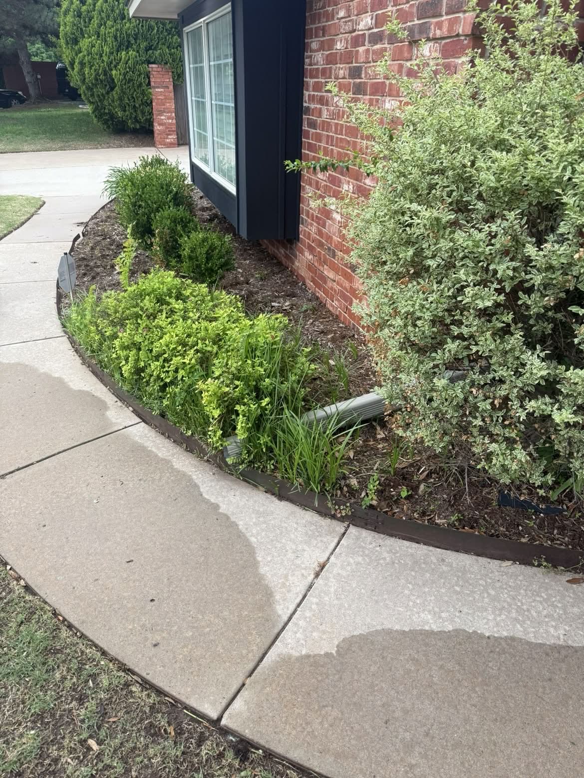 Flower bed before mulch install Edmond OK